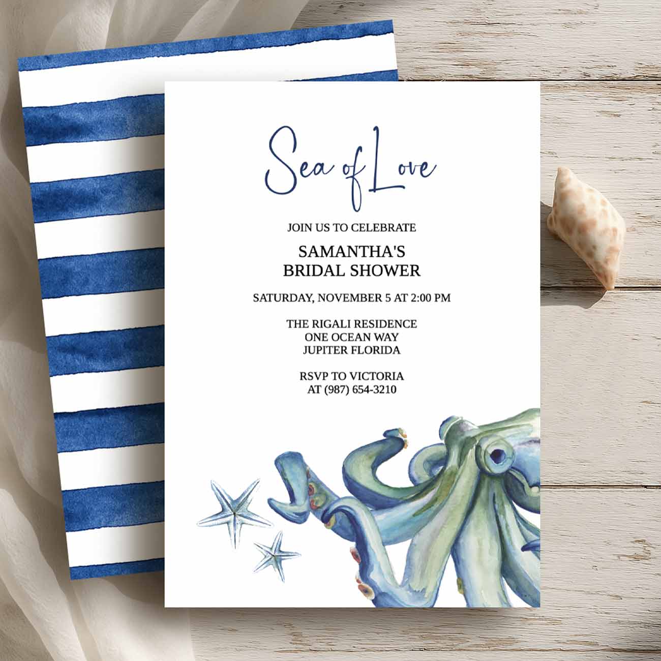 Nautical bridal shower invitations features a flat lay of a design with blue watercolor octopus art by Victoria Grigaliunas of Do Tell A Belle