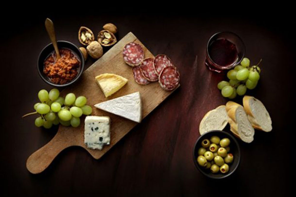 cheese board ideas. meat, cheese, bread, nuts, olives and grapes