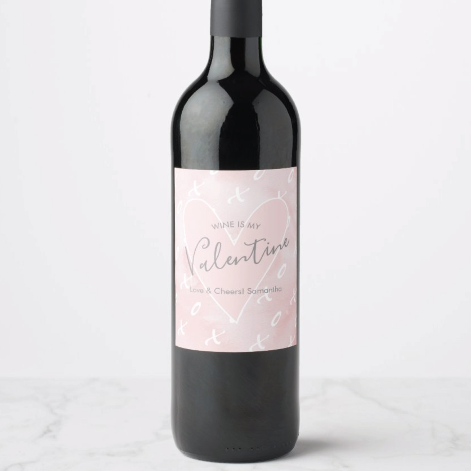 My witty wine labels feature a pink heart with an x and o pattern over a watercolor background. The words "Wine is my Valentine" is set in a trendy script typography. A perfect gift for the wine lover in your life or to give as a thank you. Click to shop this Valentine's Day Wine Label