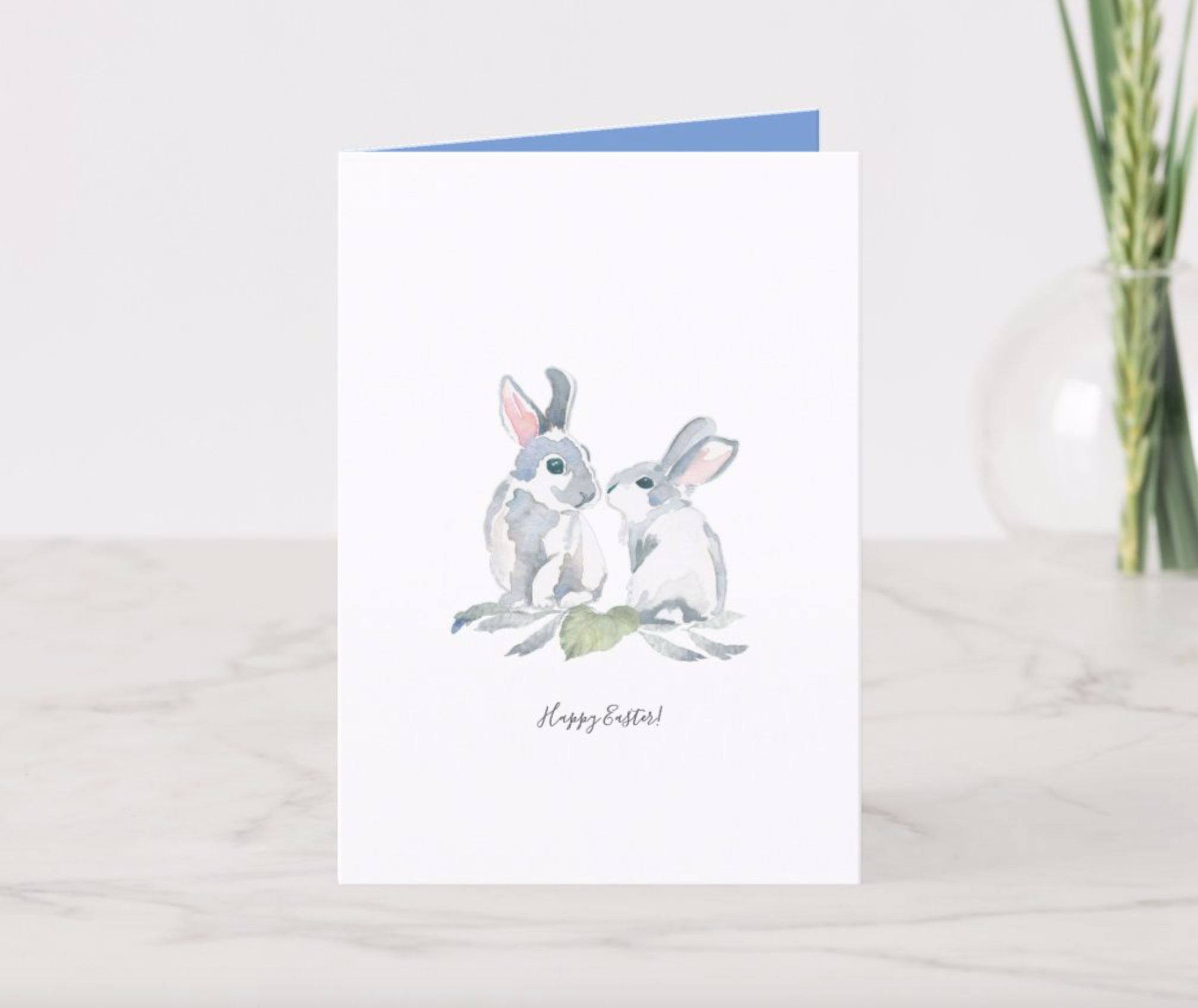 2 watercolor Easter bunnies on a plain white background. 