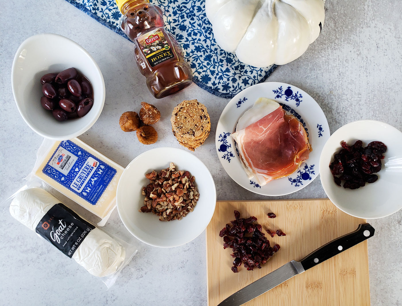 Fall charcuterie shopping list, 2 cheeses, olives, nuts, cranberries, meat 