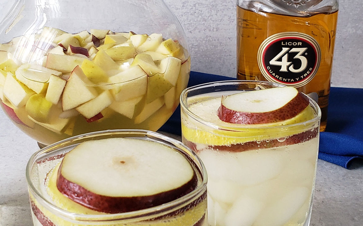 White wine sangria made with fall fruit, pinot grigio, 43 liquor