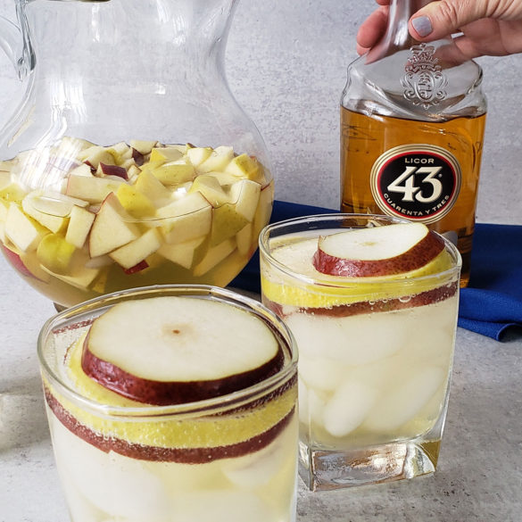 White wine sangria made with fall fruit, pinot grigio, 43 liquor