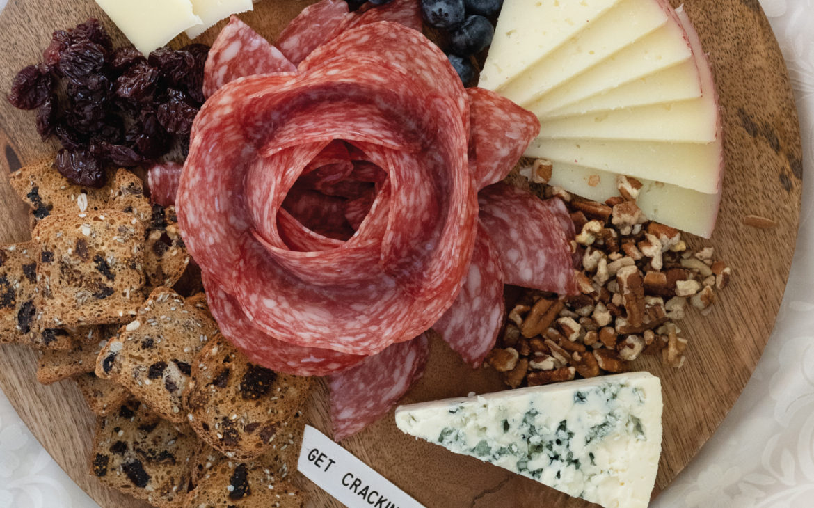 how to make a charcuterie grazing board for 2. Add in a pretty salami flower.