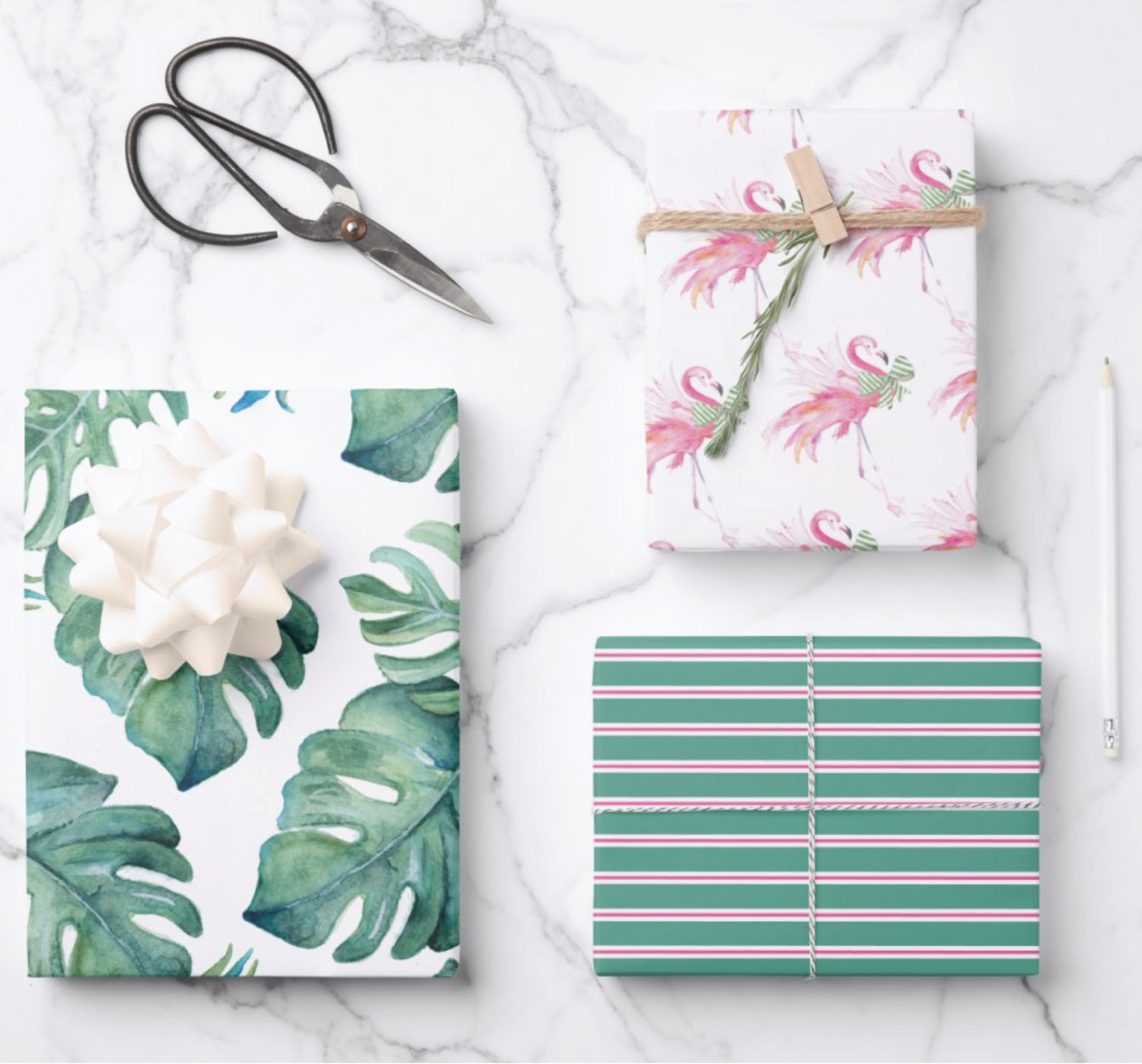 Shop my line of tropical inspired gift wrapping paper designed using my original watercolor art. Shown here are pink flamingos with green bows, monstera leaves and pink and green stripes. Perfect for Palm Beach Christmas. Click to shop my complete line.