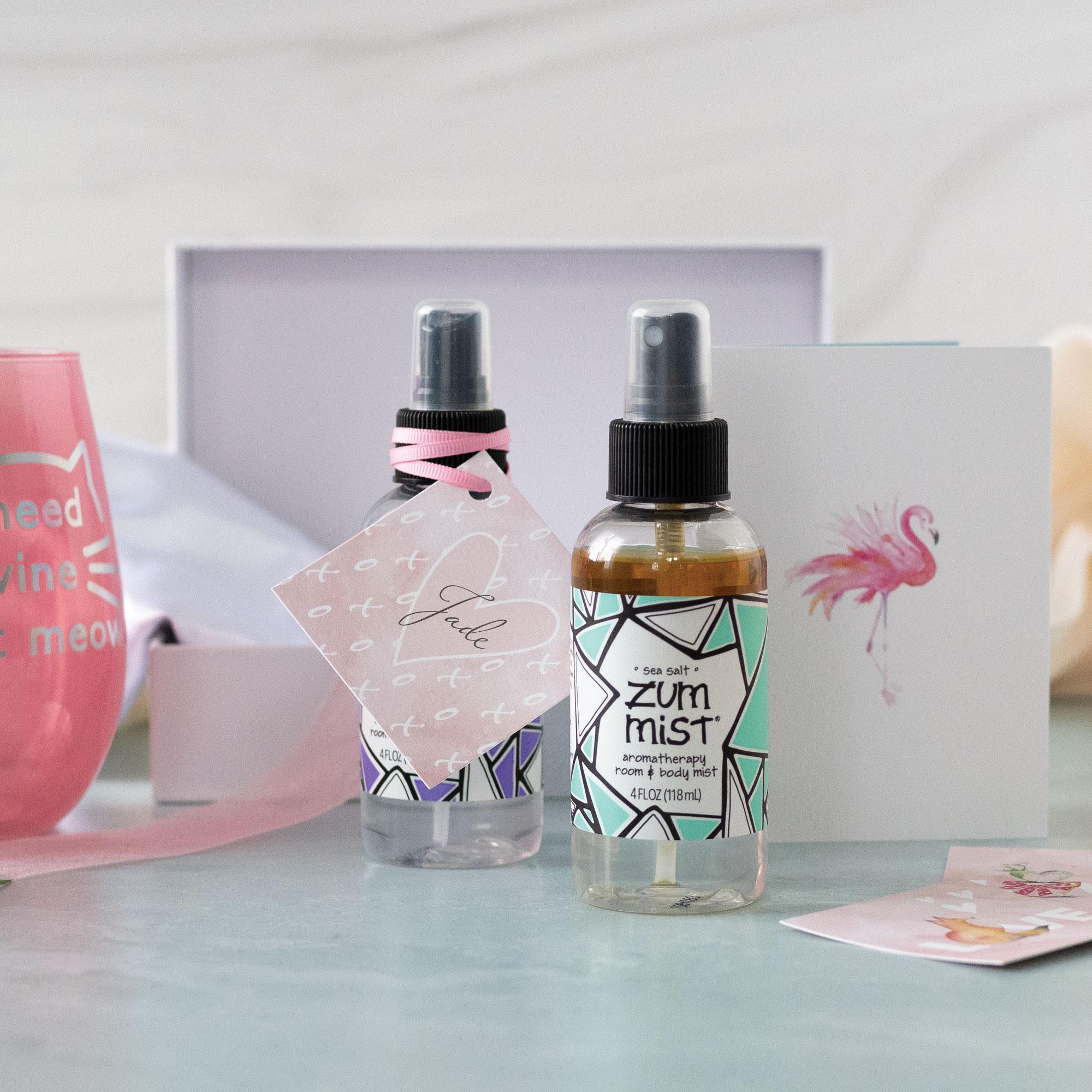 DIY Bridal Party Gift Box features Zum Mist spray, a satin pillowcase and tropical watercolor blank cards to write your bridesmaid proposal. 