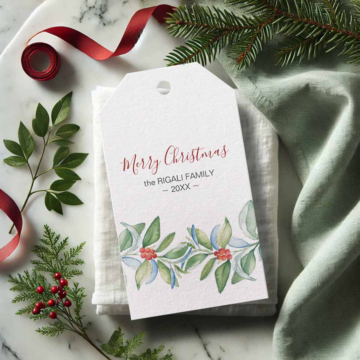 Personalized Christmas holiday gift tags with watercolor leaves and berries by Victoria Grigaliunas of Do Tell A Belle