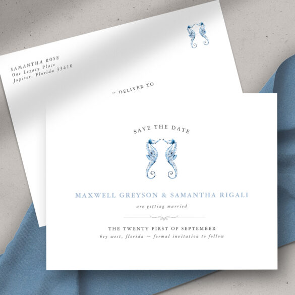 beach wedding invitation features dusty blue watercolor seahorse art by Victoria Grigaliunas