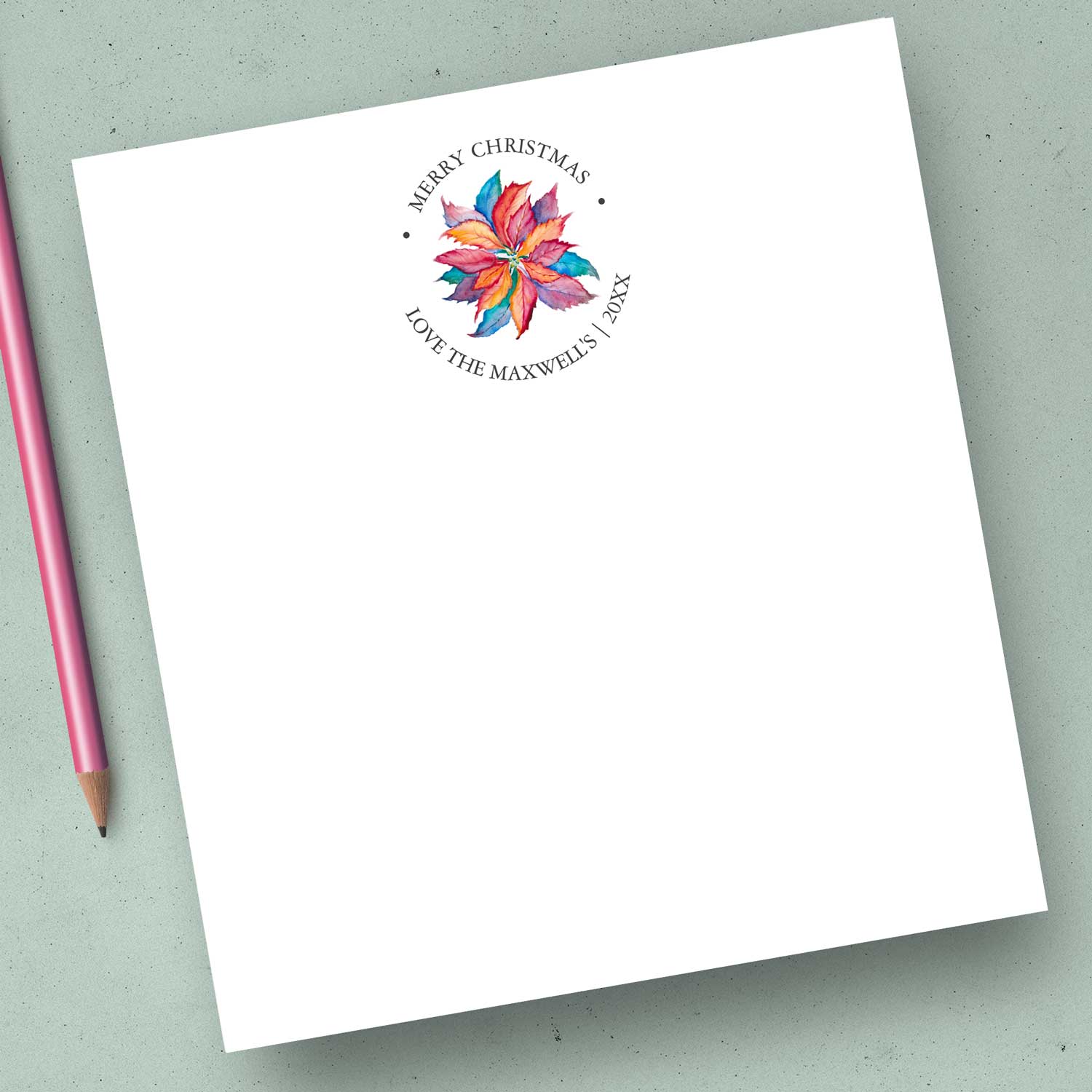 Bulk Christmas notepads feature a watercolor poinsettia encircled by your custom text. Click to shop