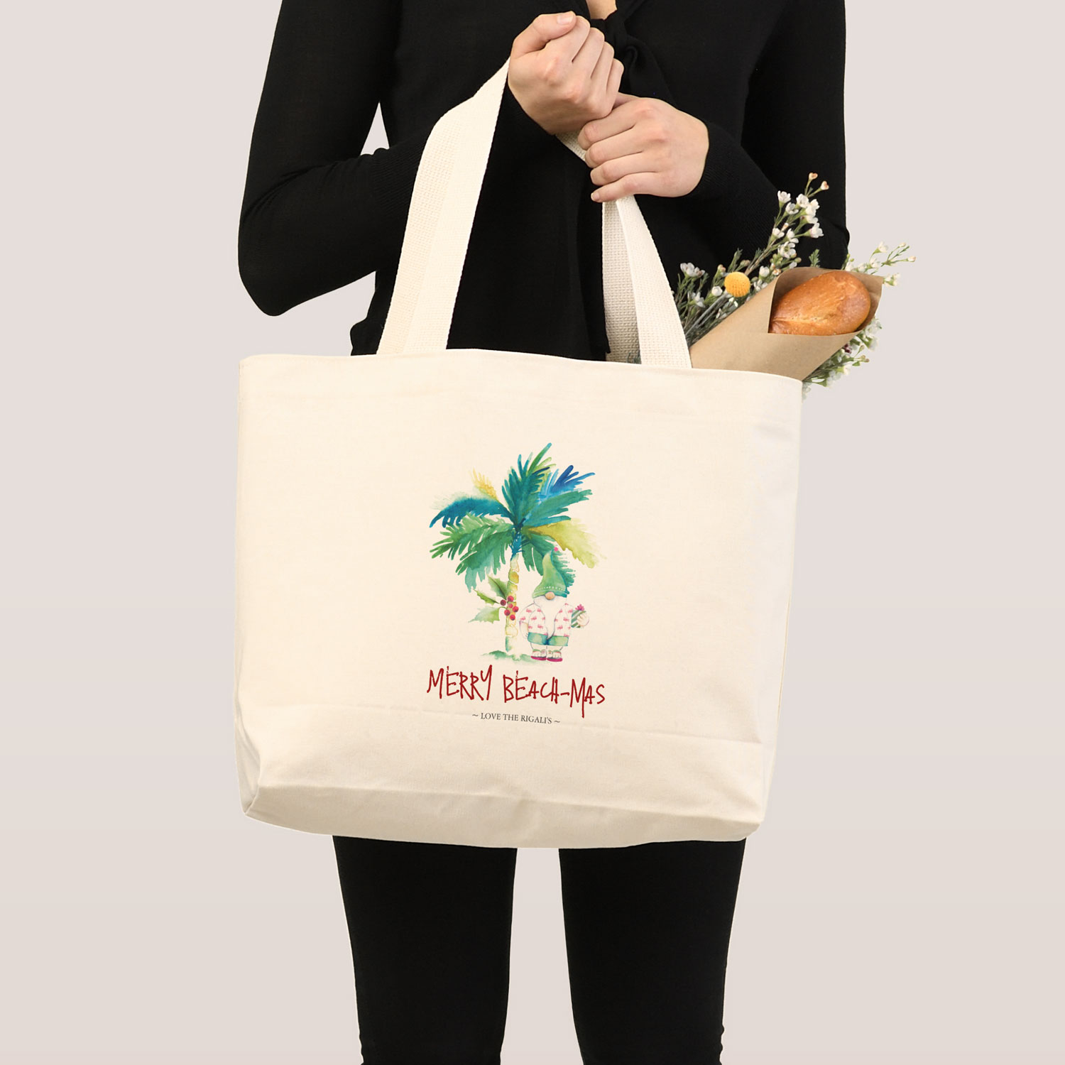 personalized Christmas tote bags feature a watercolor palm tree and santa in beach shorts and a hawaiian shirt. Click to shop.