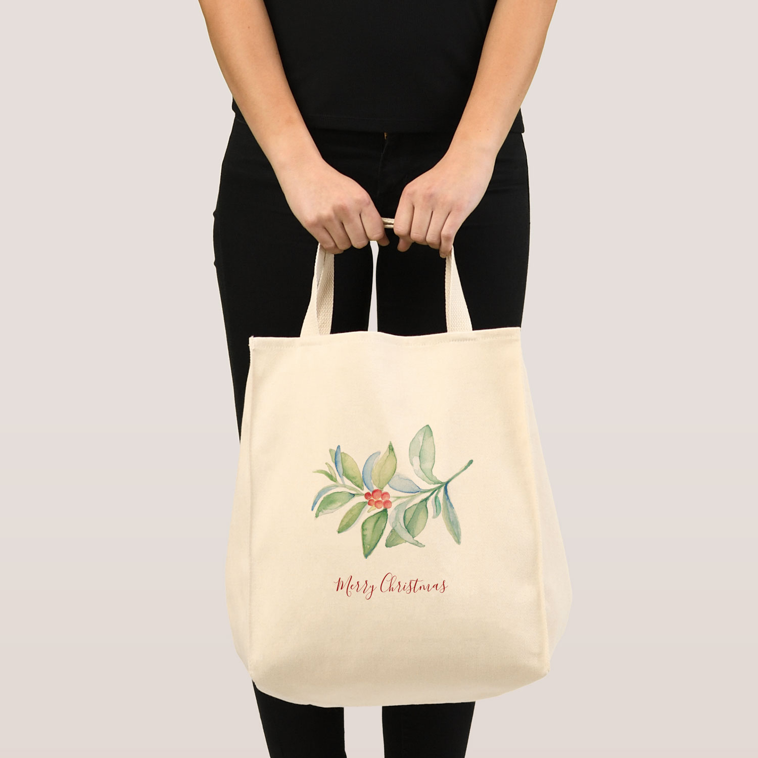 Reusable Christmas shopping bags feature unique watercolor greenery and red berries. Click to shop