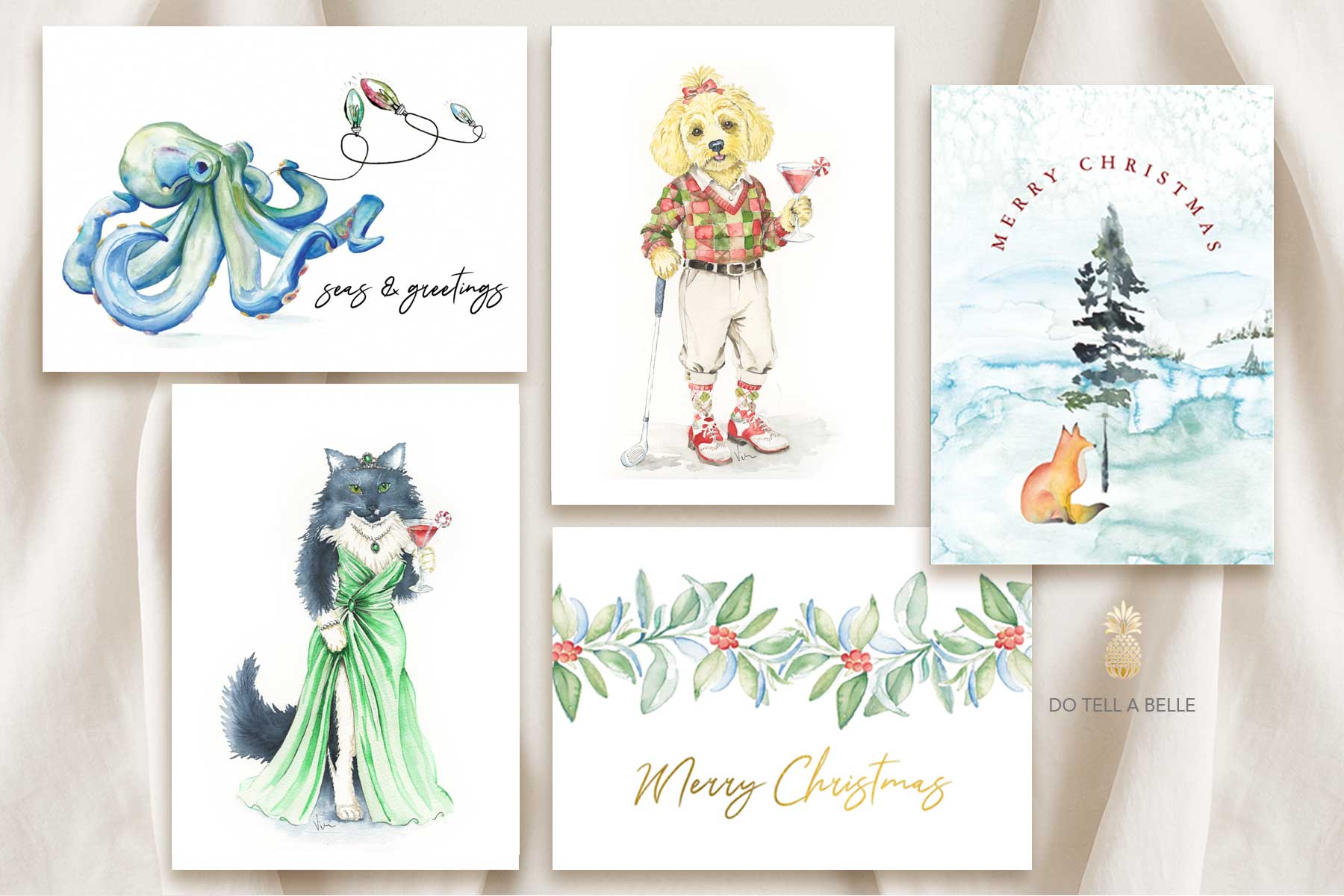 Watercolor Christmas cards features a flat lay of assorted xmas cards with hand painted art by small business owner Victoria of Do Tell A Belle.