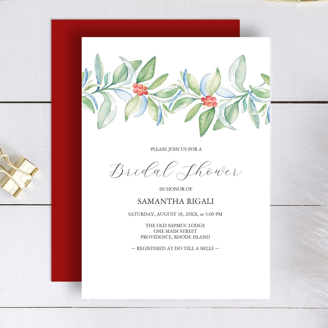 Winter bridal shower invitations features a top boarder of Christmas greenery and red berries watercolor art by Victoria Grigaliunas. Click to shop.