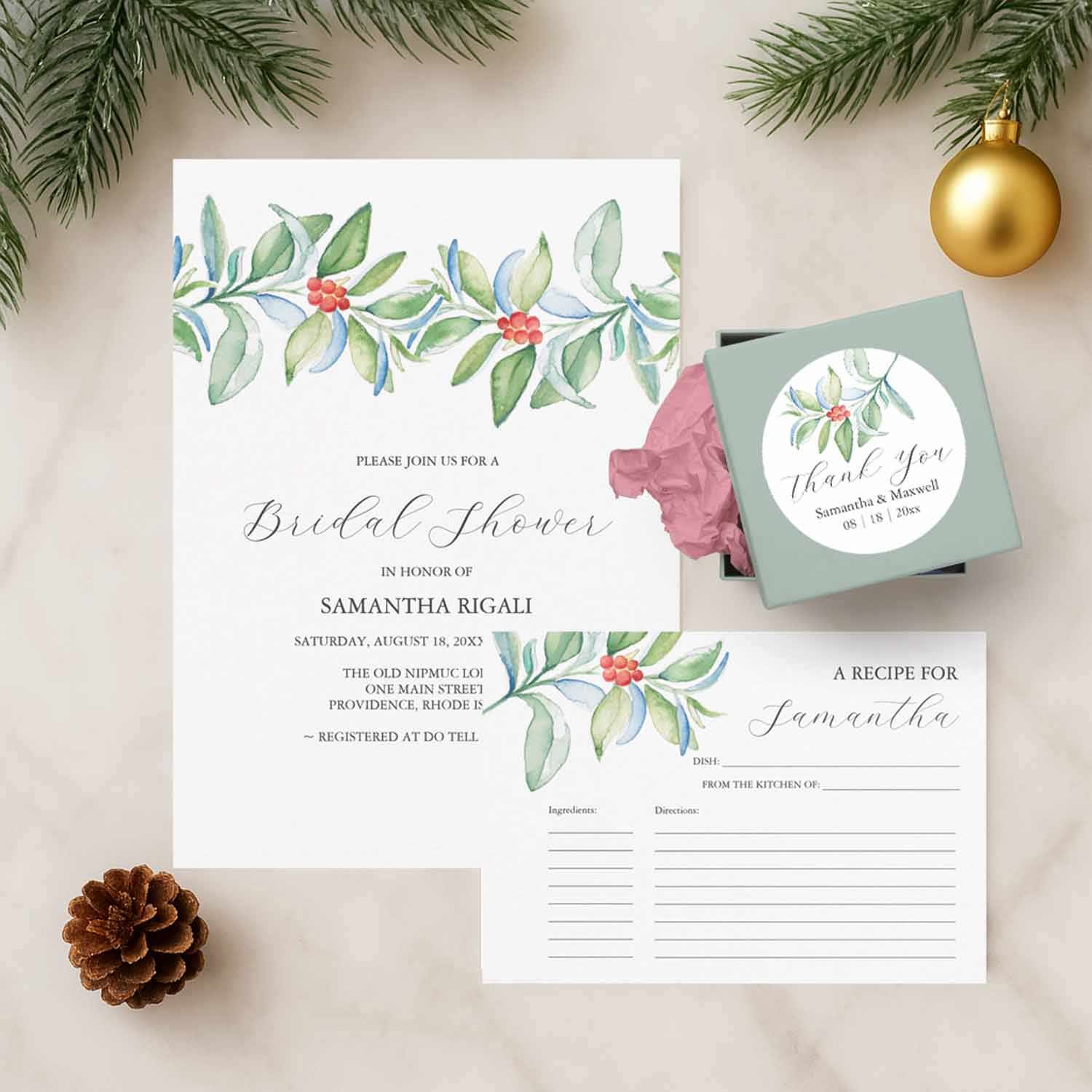 Elegant winter bridal shower invitation suite featuring white paper, green watercolor botanicals, and red berries — perfect for a winter bridal shower theme with gold accents.