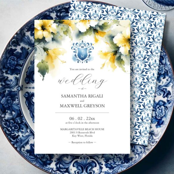 Wedding invitations feature watercolor blue monogrammed crest and yellow hibiscus flowers.