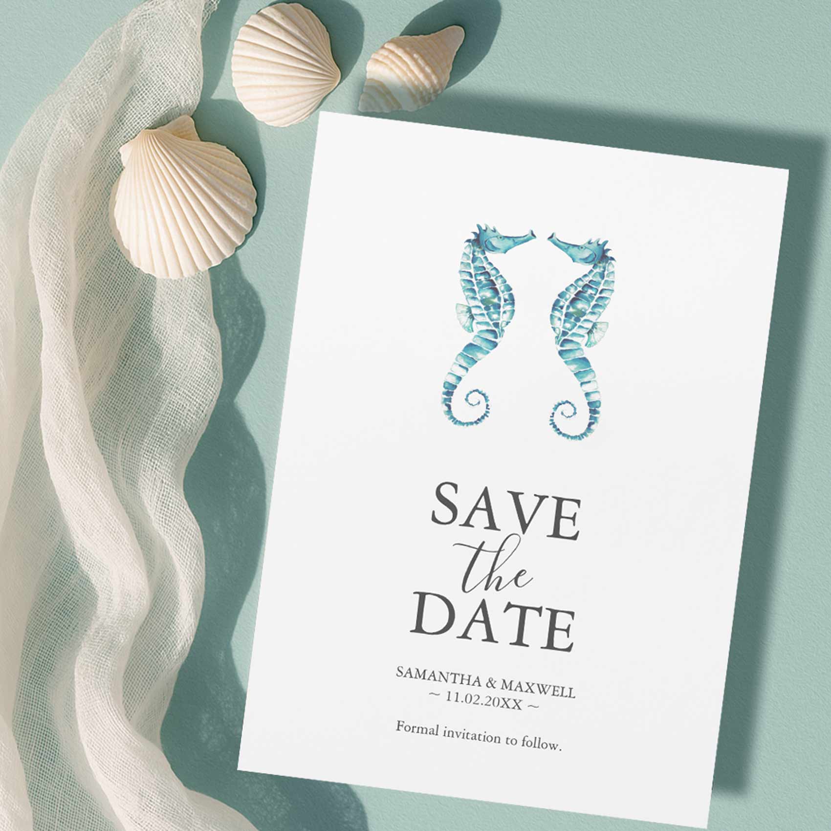Beach wedding save the date featuring hand-painted watercolor seahorses in soft shades of blue.