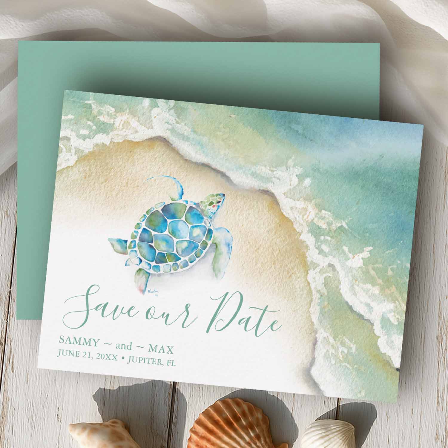 5 x 7 save the dates featuring a hand-painted watercolor sea turtle swimming along a tropical shoreline.