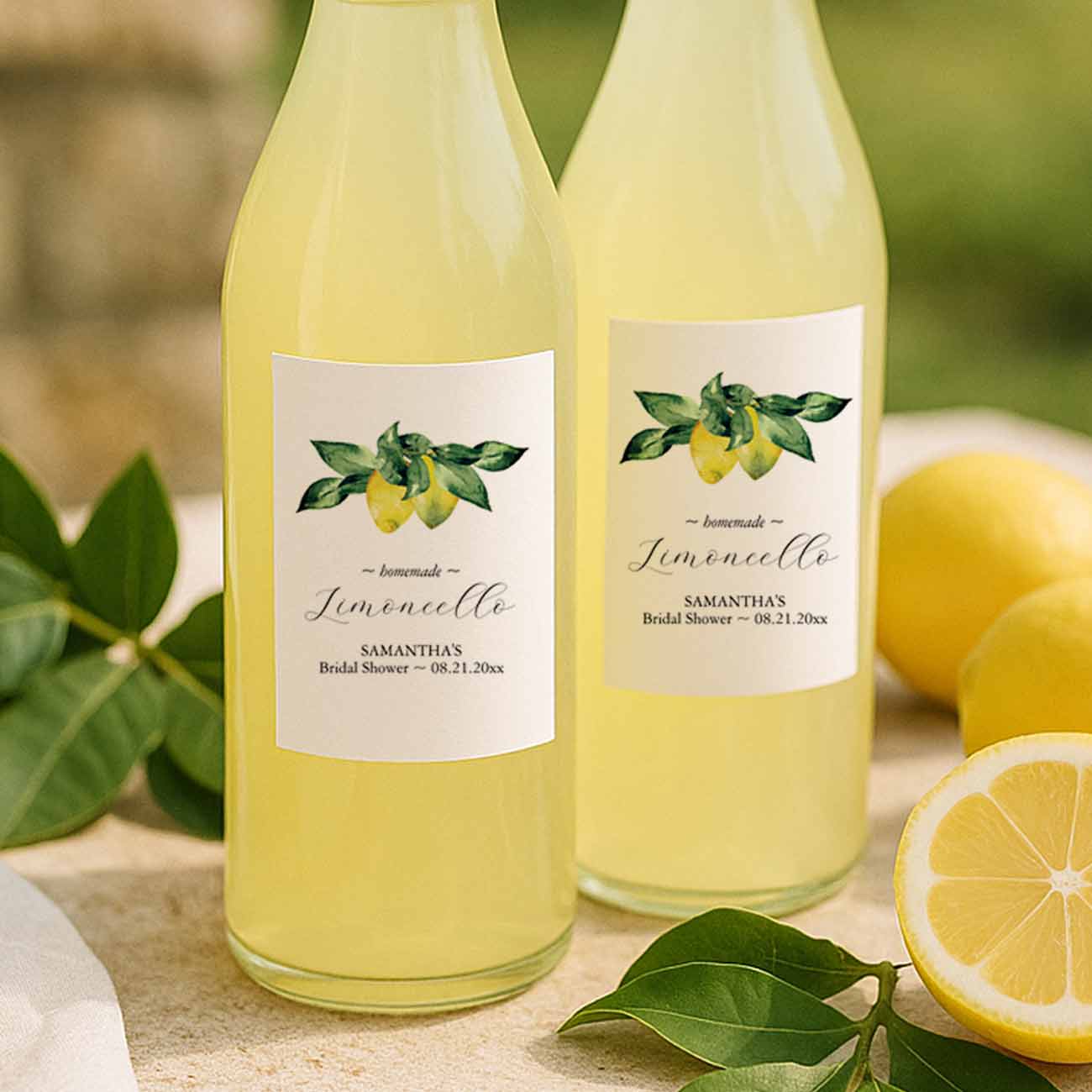 bridal shower themes for summer feature personalized lemon stickers on small bottles of limoncello for thank you gifts.