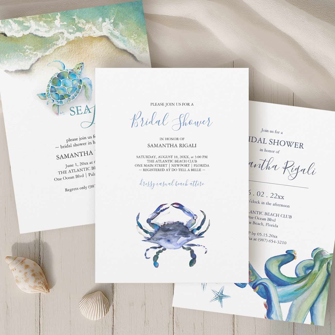 beach bridal shower invitations in shades of teal and blue feature watercolor crabs, sea turtle, octopus and starfish with a shoreline. 