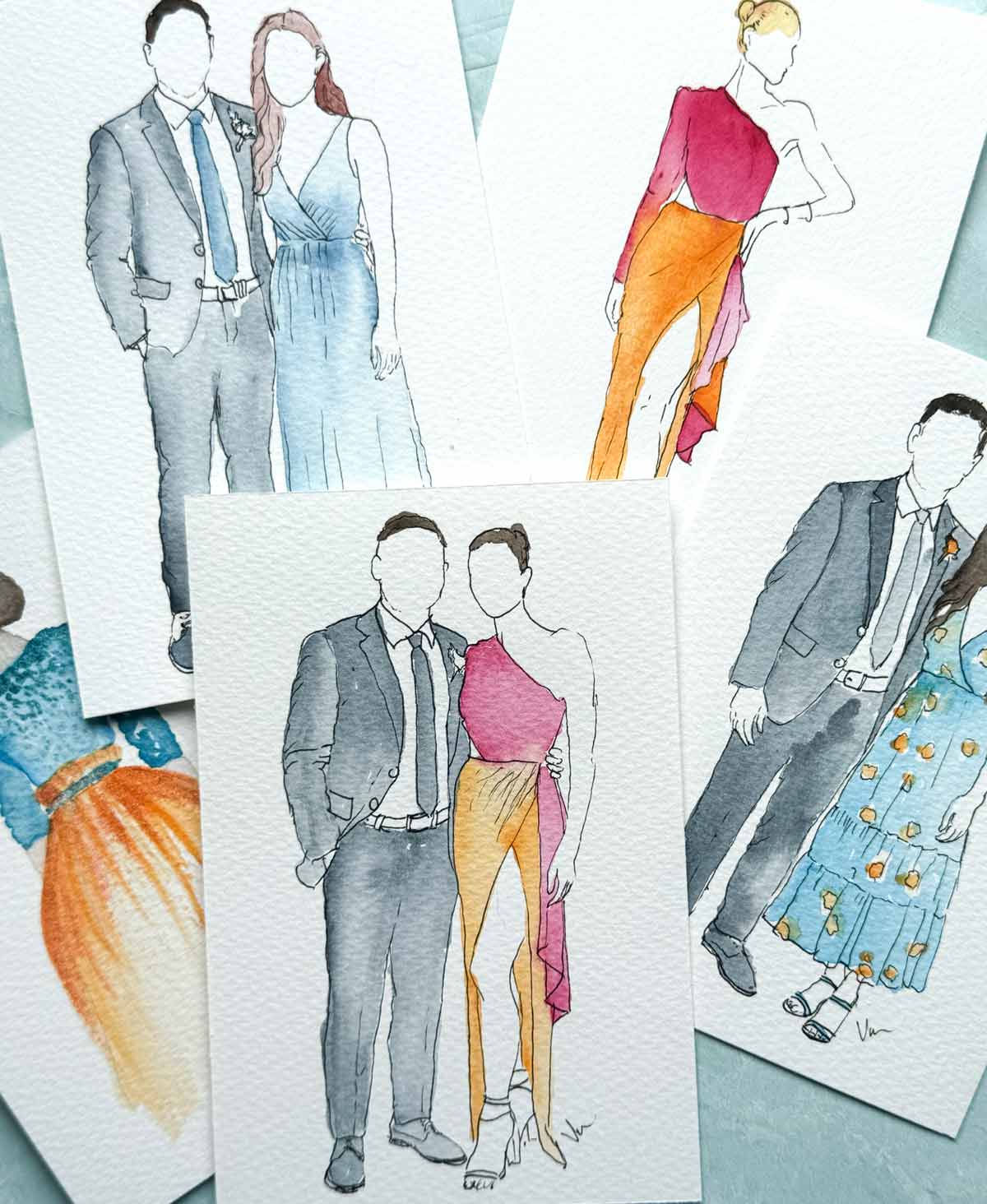 live wedding painting features a flat lay of watercolor guest portraits by Florida artist Victoria Grigaliunas of Do Tell A Belle