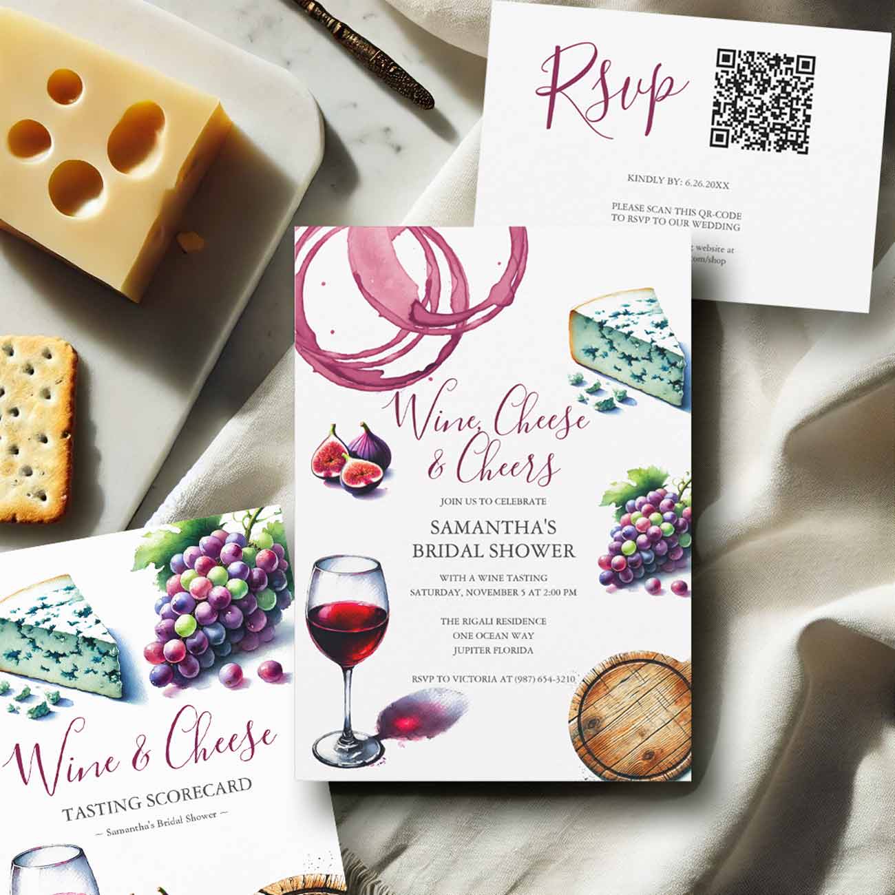 Flat lay of wine bridal shower theme stationery set featuring bridal shower invitations, RSVP card, and wine tasting scorecard, designed with elegant burgundy watercolor details and coordinating party decoration kits for a winery bridal shower or wine tasting bridal shower.
