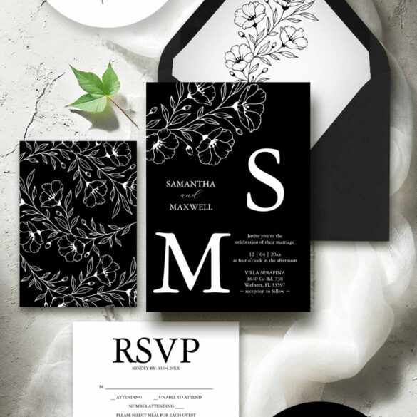 Flat lay of a wedding invitations black and white suite with hand drawn floral line art by Do Tell A Belle.