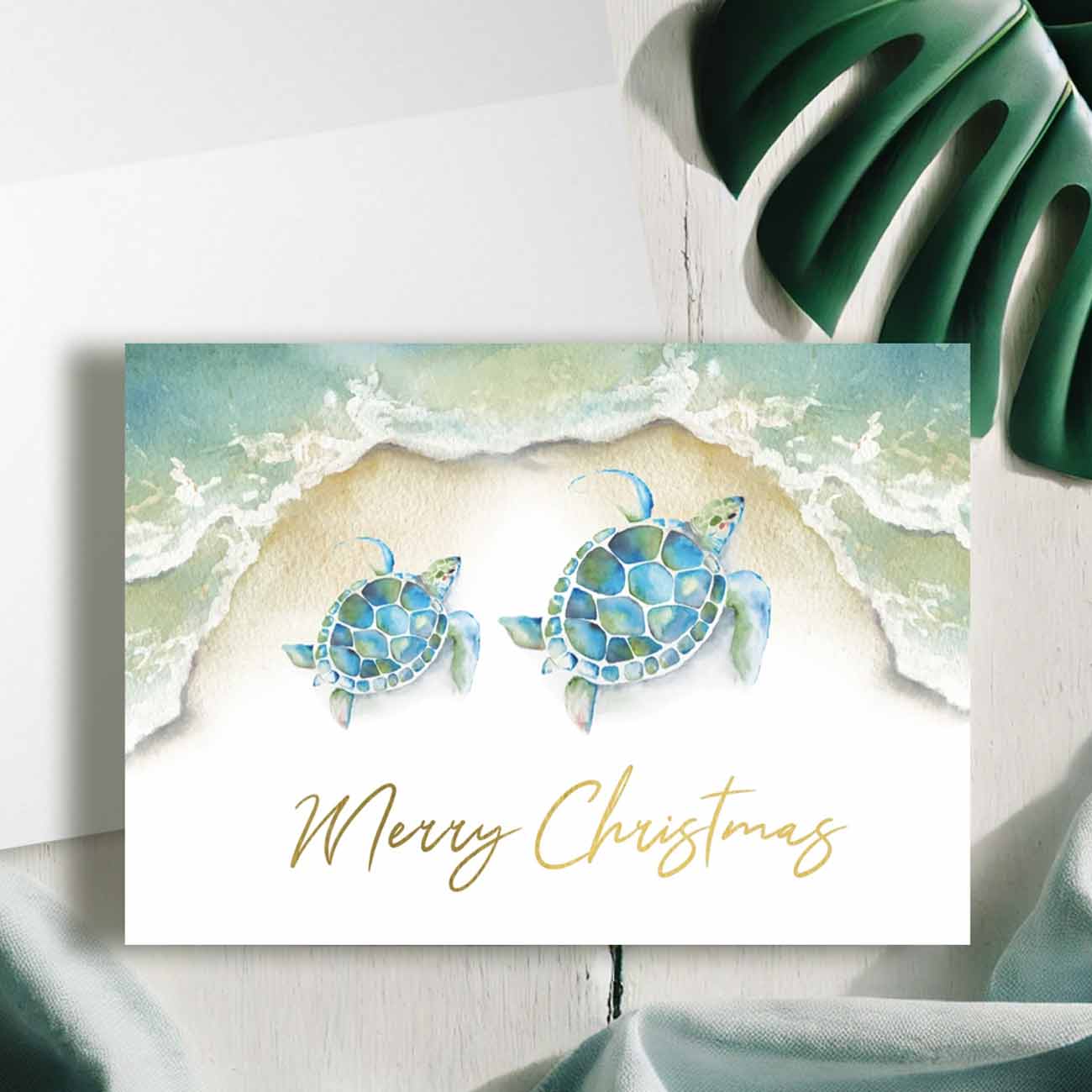 Watercolor sea turtle Christmas cards designed with art by Victoria Grigaliunas of Do Tell A Belle a woman owned small business. 