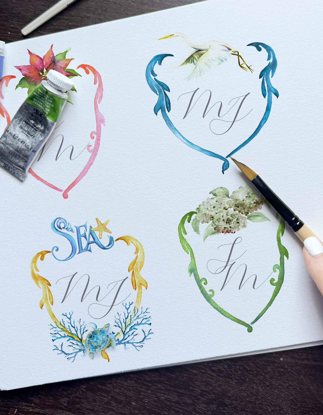 custom wedding crest images shows a variety of watercolor monogrammed crests by Victoria Grigaliunas a South Florida Watercolor artist with Do Tell A Belle.