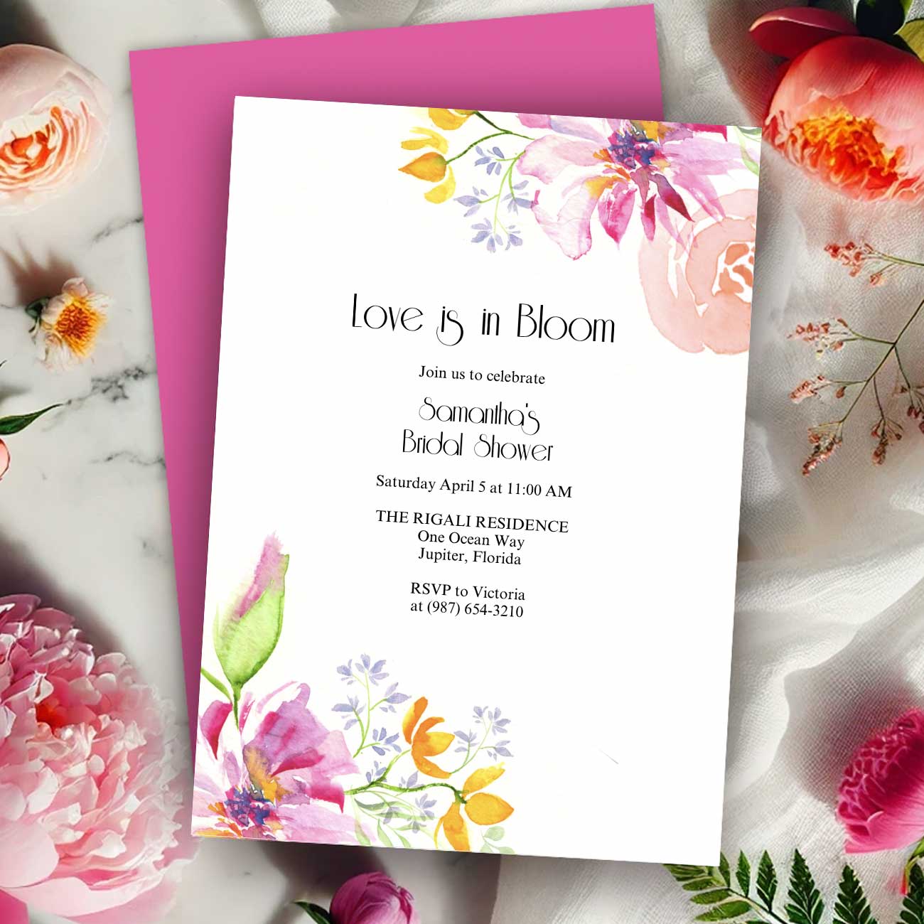 Love Is in Bloom bridal shower invitation designed by Do Tell A Belle, a woman-owned small business, featuring watercolor florals in pink and orange.