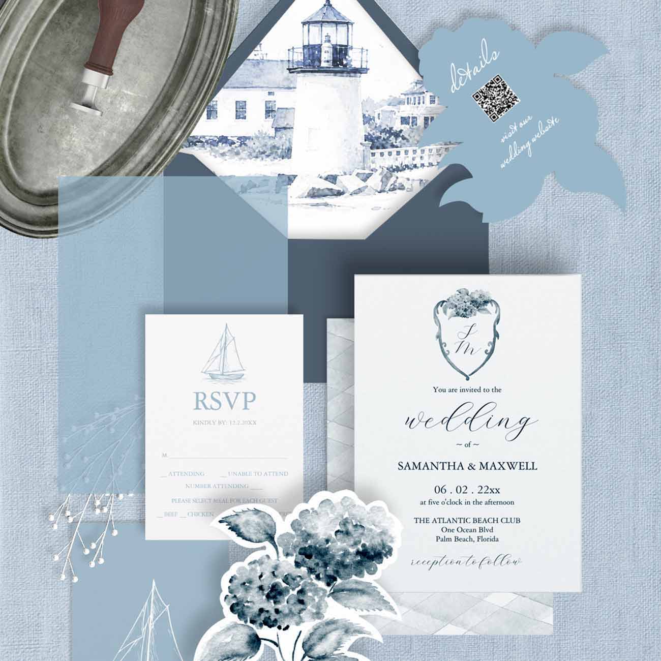 Watercolor beach wedding invitation with dusty blue hydrangeas, monogrammed crest, and lighthouse venue art envelope liner in coastal blue palette