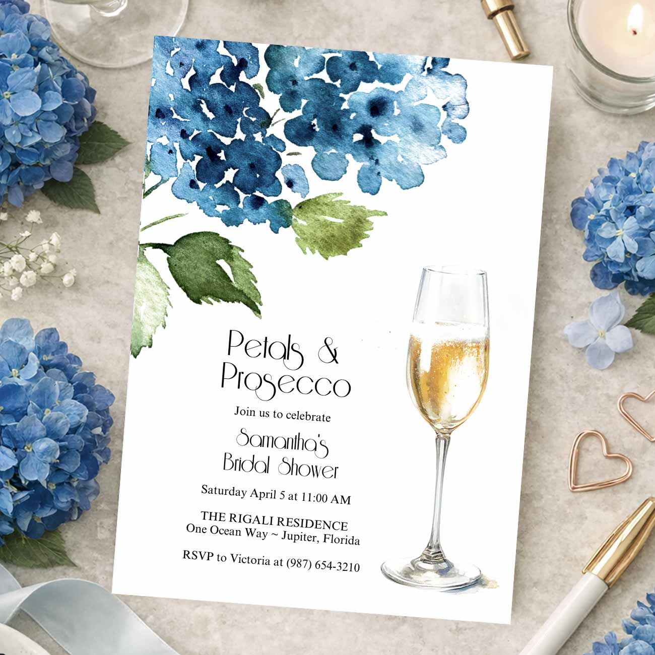 Blue petals and Prosecco bridal shower invitations templates designed with hand painted hydrangea art by Florida watercolor artist Victoria Grigaliunas of Do Tell A Belle. Tap to shop this invite.