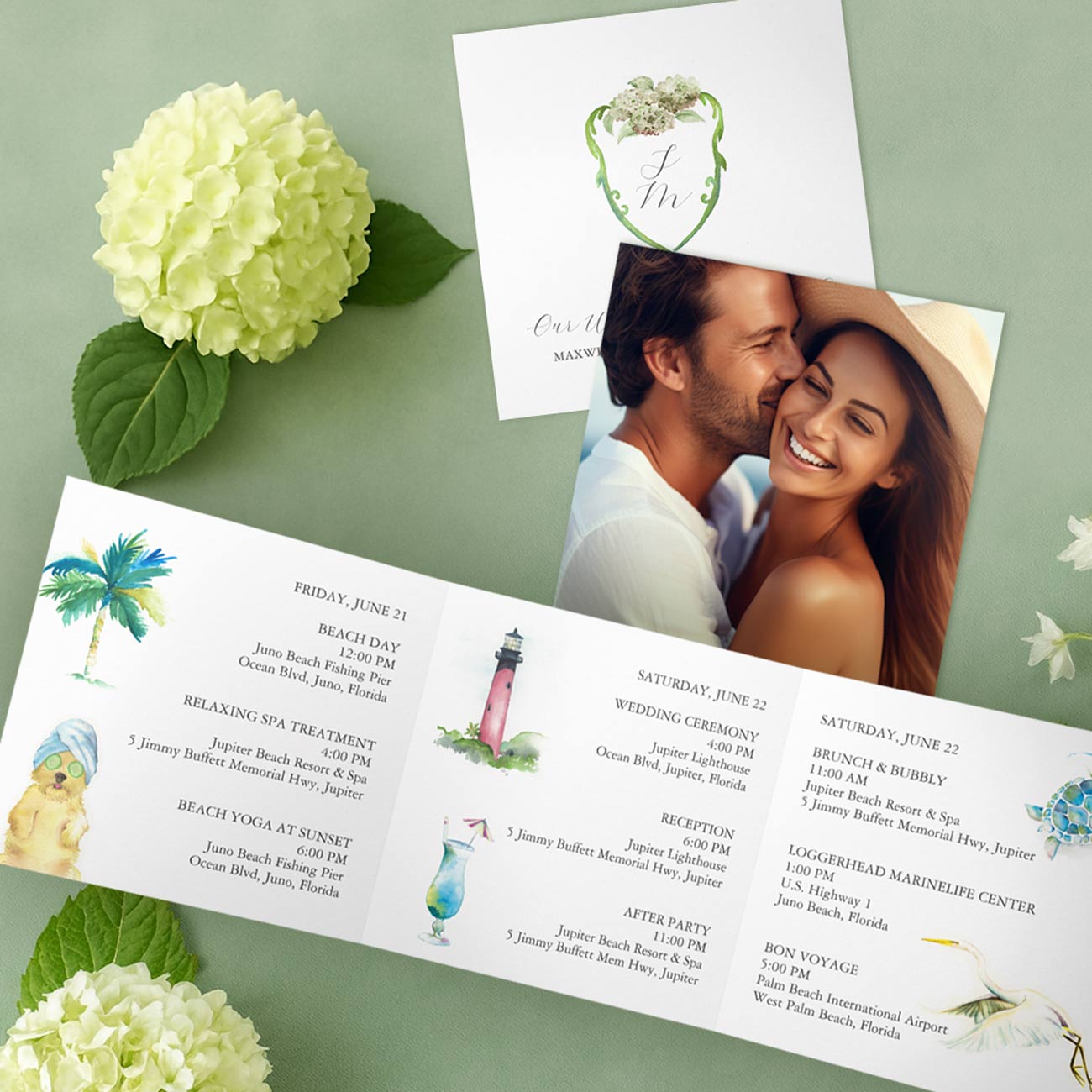 Tri-fold watercolor destination wedding invitation featuring illustrated icons and monogram crest for a Florida wedding, designed by Victoria Grigaliunas of Do Tell A Belle. Top-rated services for bespoke watercolor wedding invitation printing.