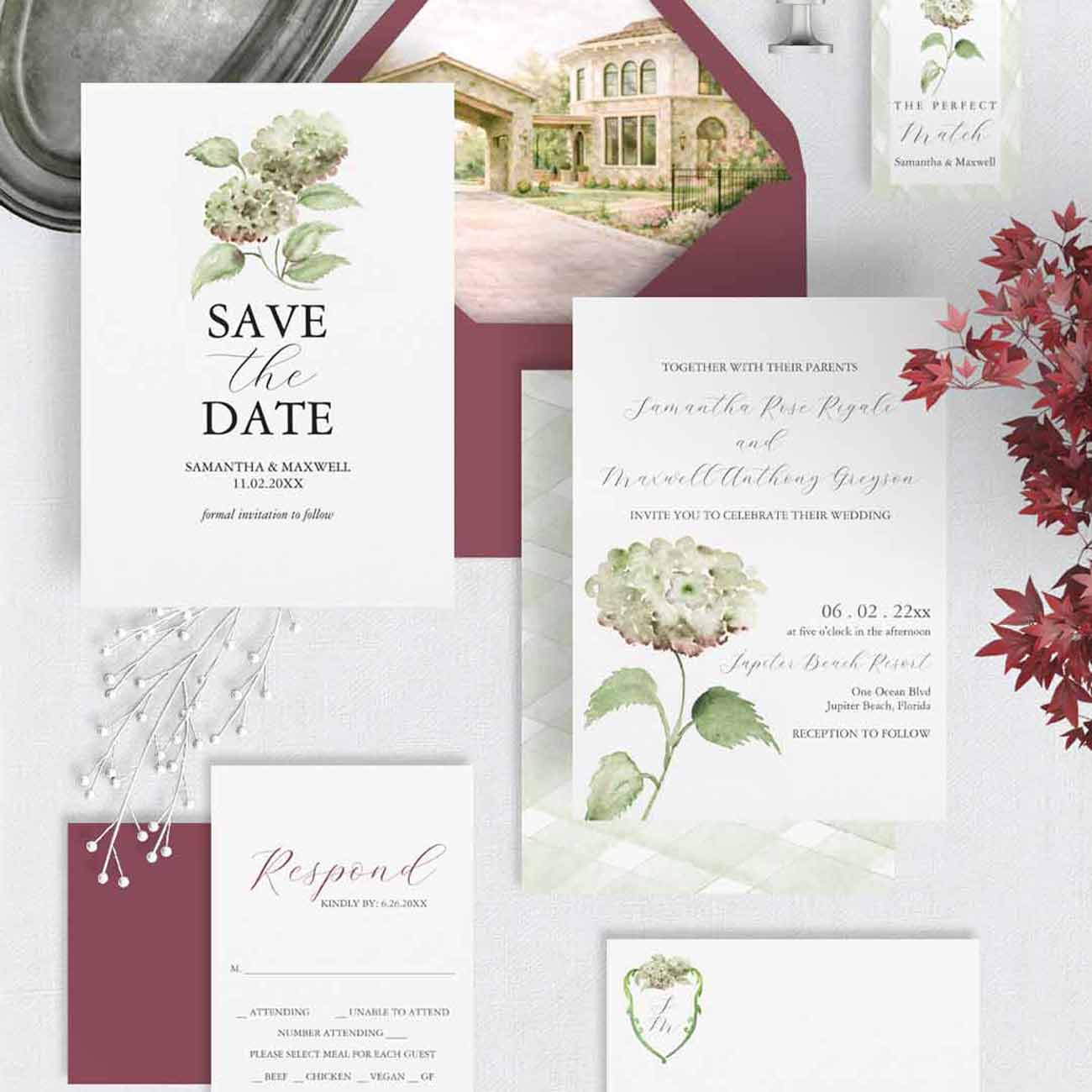 Watercolor wedding invitations by Do Tell A Belle featuring green and burgundy hydrangeas, custom monogram crest, and hand-painted venue artwork compared to Minted style invitations