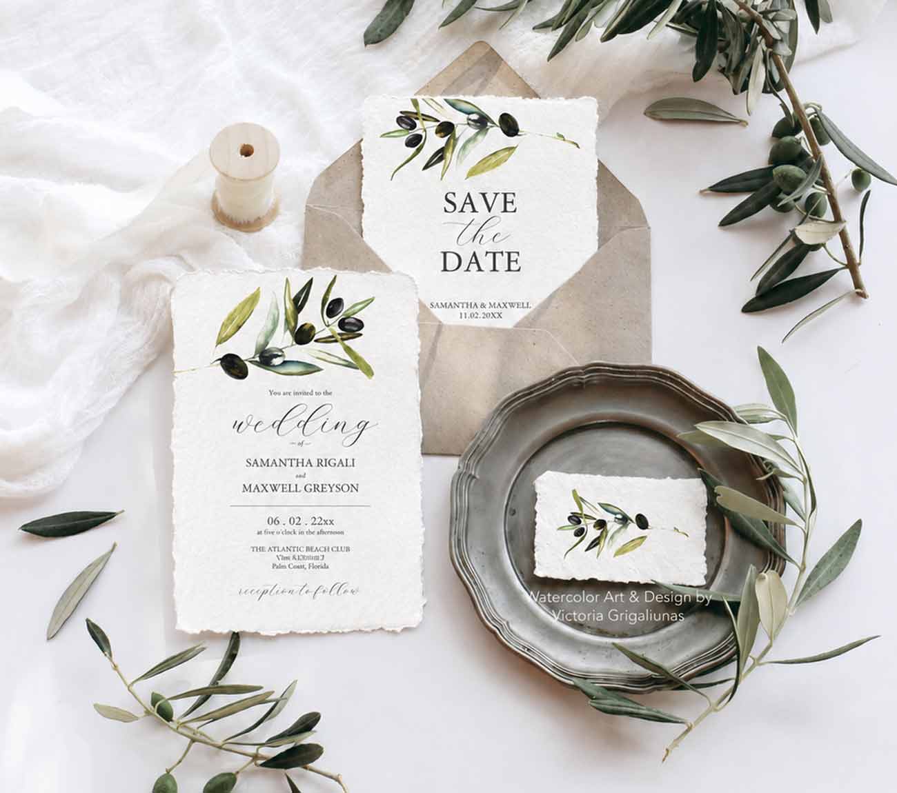 Semi-custom watercolor wedding invitations with hand-painted olive branches printed on elegant handmade deckled edge paper.