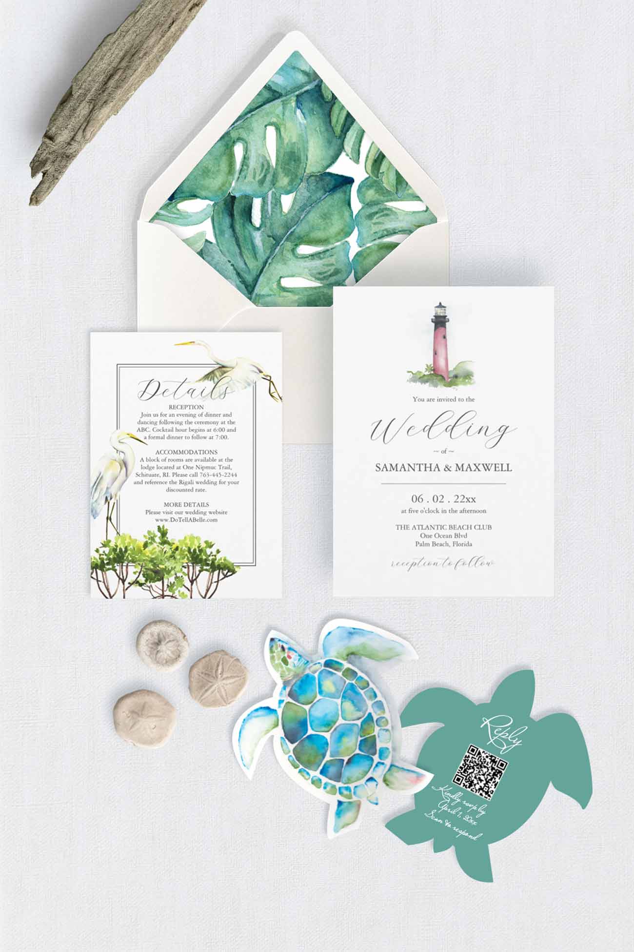 A styled flat-lay of a wedding invitation suite featuring the Jupiter Lighthouse illustration on the main invitation, tropical green watercolor leaves on the envelope liner, a great white heron bird on the details card, and matching sea turtle and turtle-shaped cardstock cutouts rsvp cards with qr-code on a light textured background.
