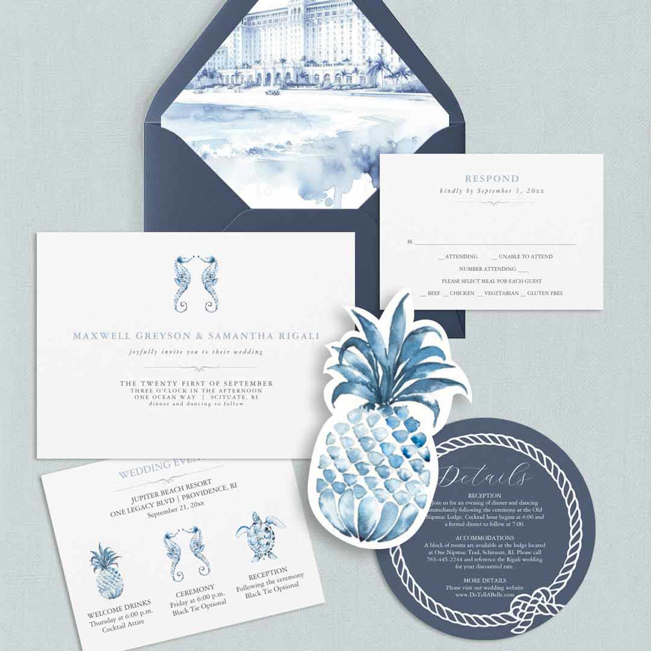 Unique destination wedding invitation design in dusty blue featuring a die-cut pineapple detail and custom watercolor venue envelope liner.
