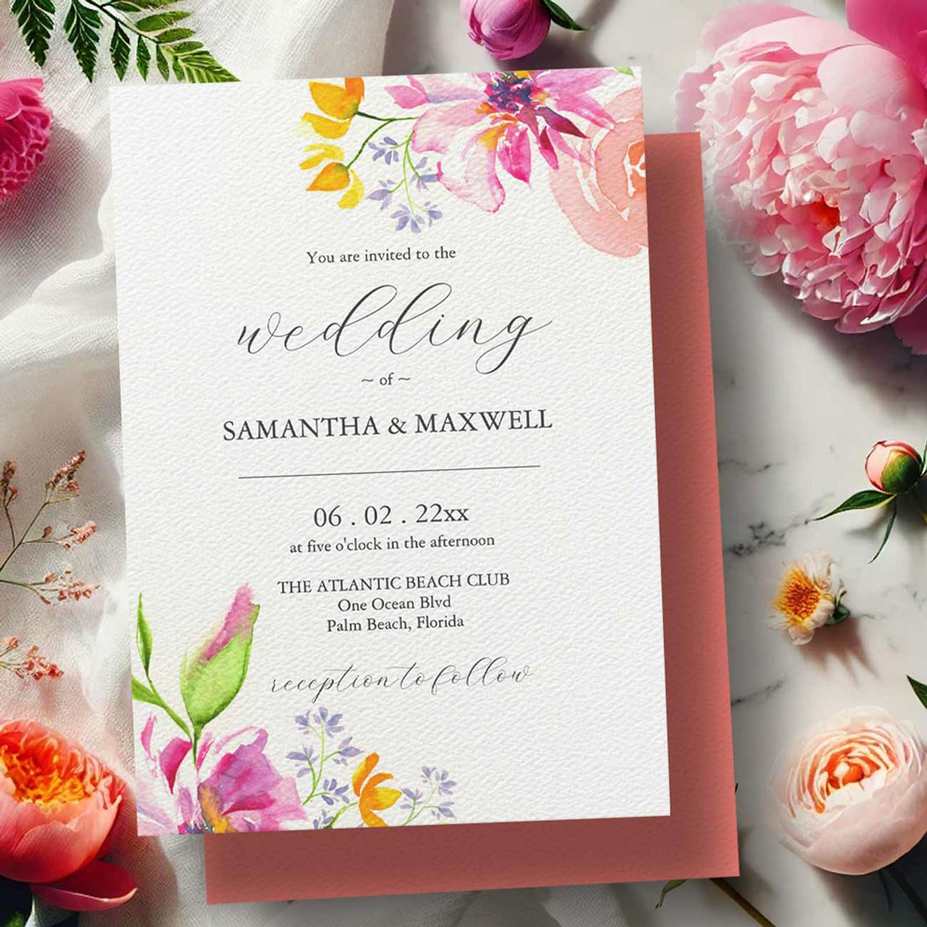Watercolor flower wedding invitations featuring hand-painted pink and orange blooms