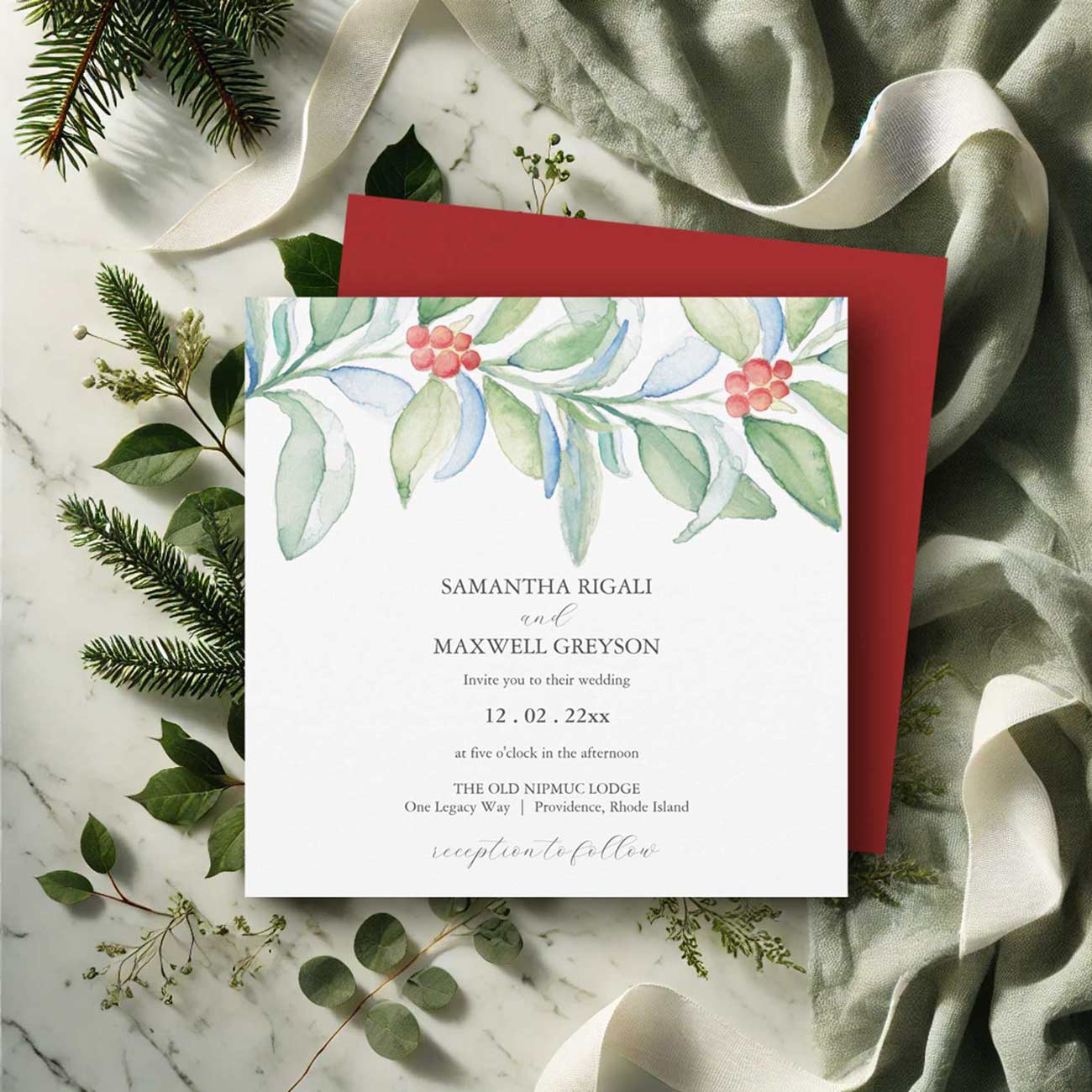 Watercolor wedding invitations featuring a Christmas botanical theme with hand-painted red and green foliage, coordinated wedding stationery, and matching envelope.