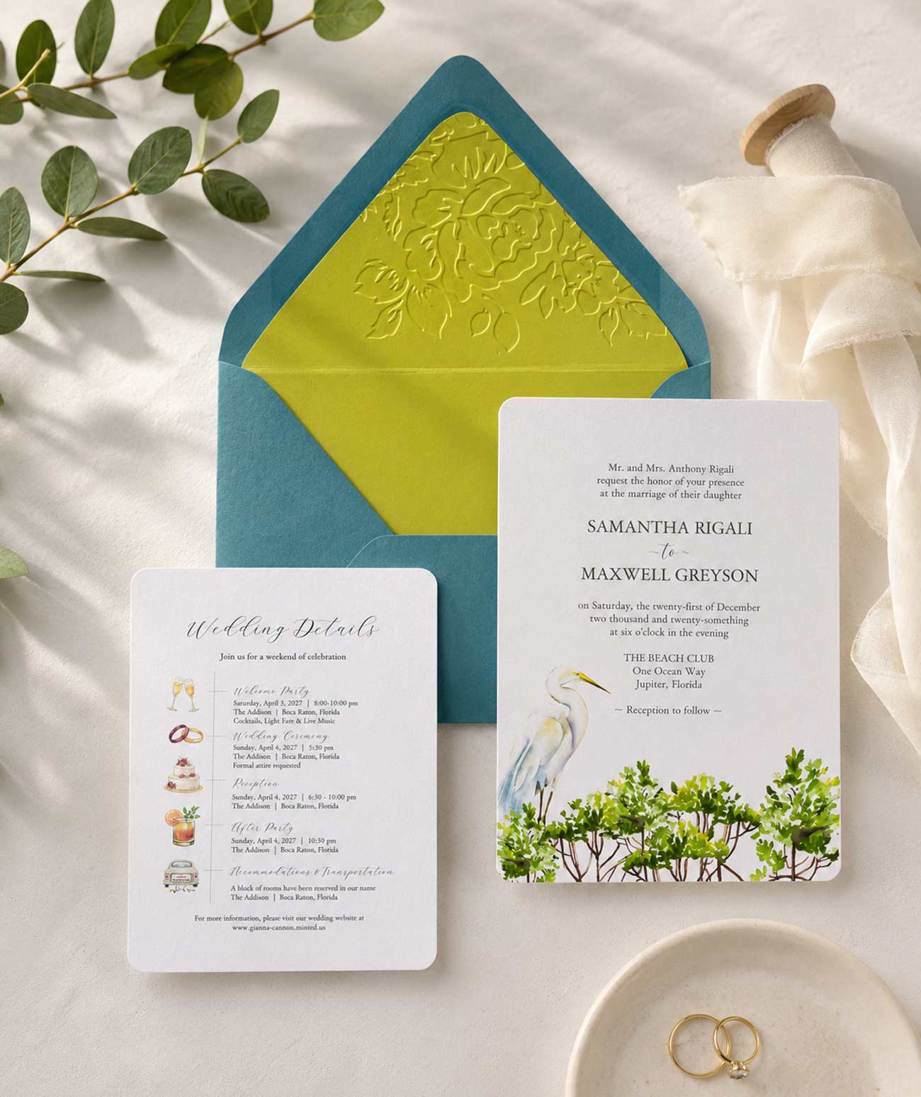 Watercolour wedding invitations featuring hand-painted Florida mangroves and a Great White Heron, custom wedding timeline card with watercolor icons, turquoise blue envelope, and green embossed envelope liner for a destination wedding.