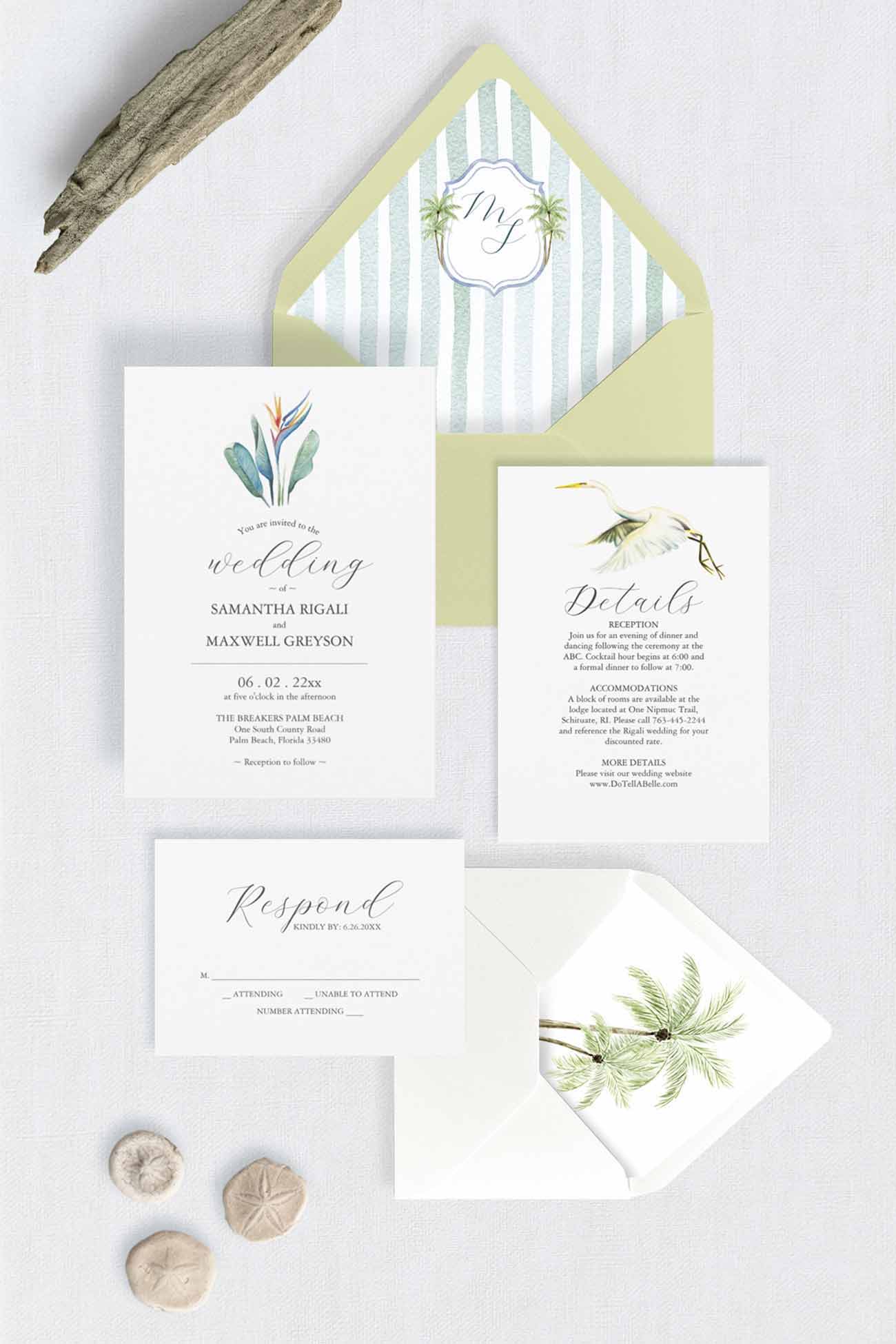 Tropical wedding invitation suite featuring a hand-painted watercolor bird of paradise invitation, monogrammed palm tree crest envelope liner, great white heron details card, and palm tree RSVP envelope liner.