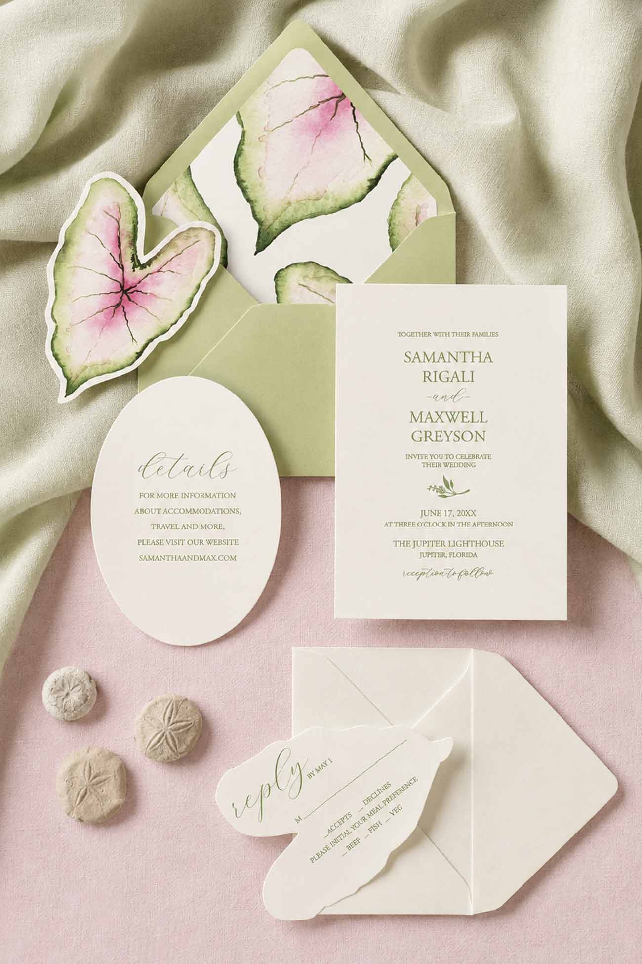 Wedding invitation sets featuring a hand-painted watercolor caladium leaf design with a laser-cut RSVP card, oval details card, cream cardstock, green envelope, and coordinating watercolor envelope liner.