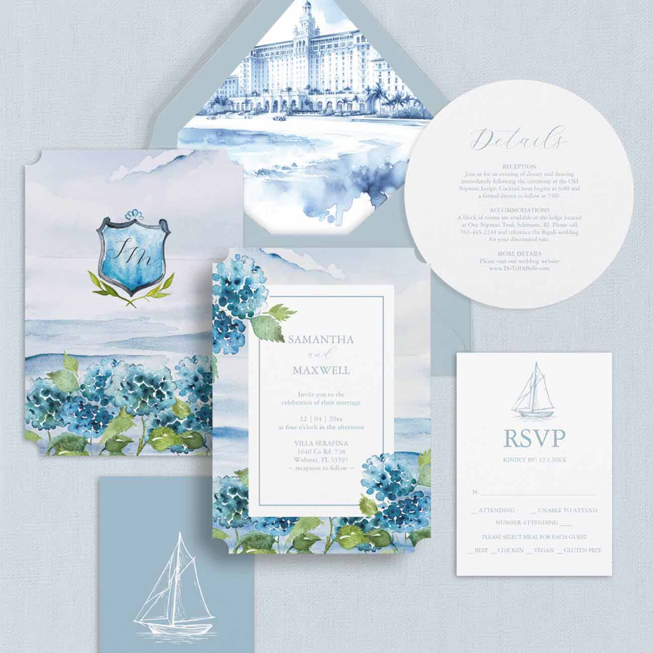 Blue watercolor wedding invitation suite with hand-painted hydrangeas, duogram crest and custom watercolor venue envelope liner.