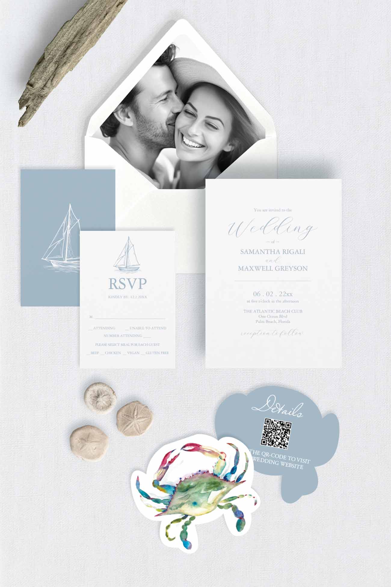 A watercolor beach wedding invitation suite designed with a laser cut blue crab