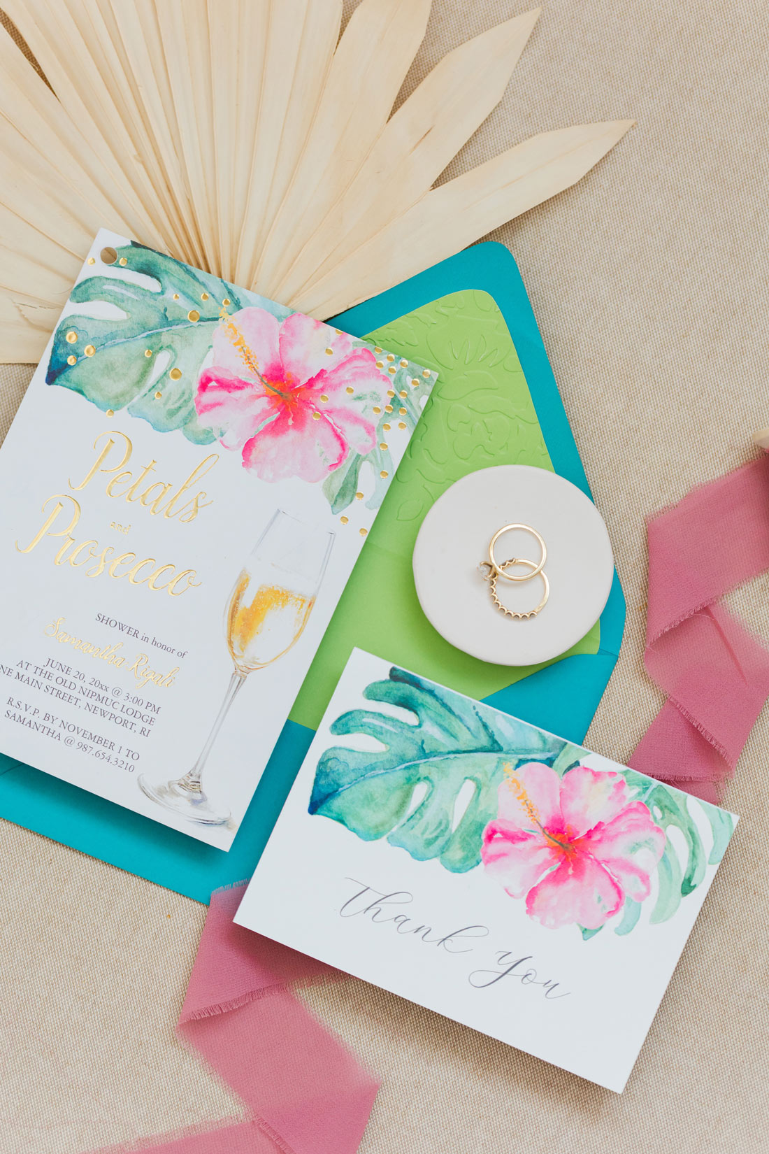 Petals and Prosecco bridal shower invitation with watercolor pink hibiscus, tropical leaves, gold foil lettering and matching thank-you card.