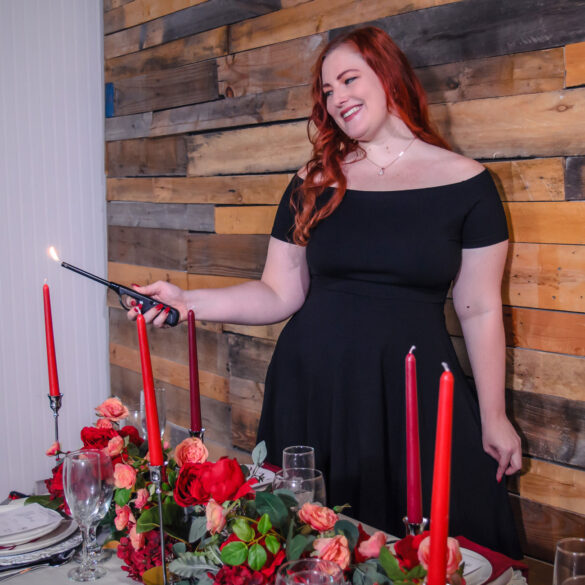 Central Florida wedding planner Kathryn of Enchanted Me preparing a wedding table as part of the wedding planning process.