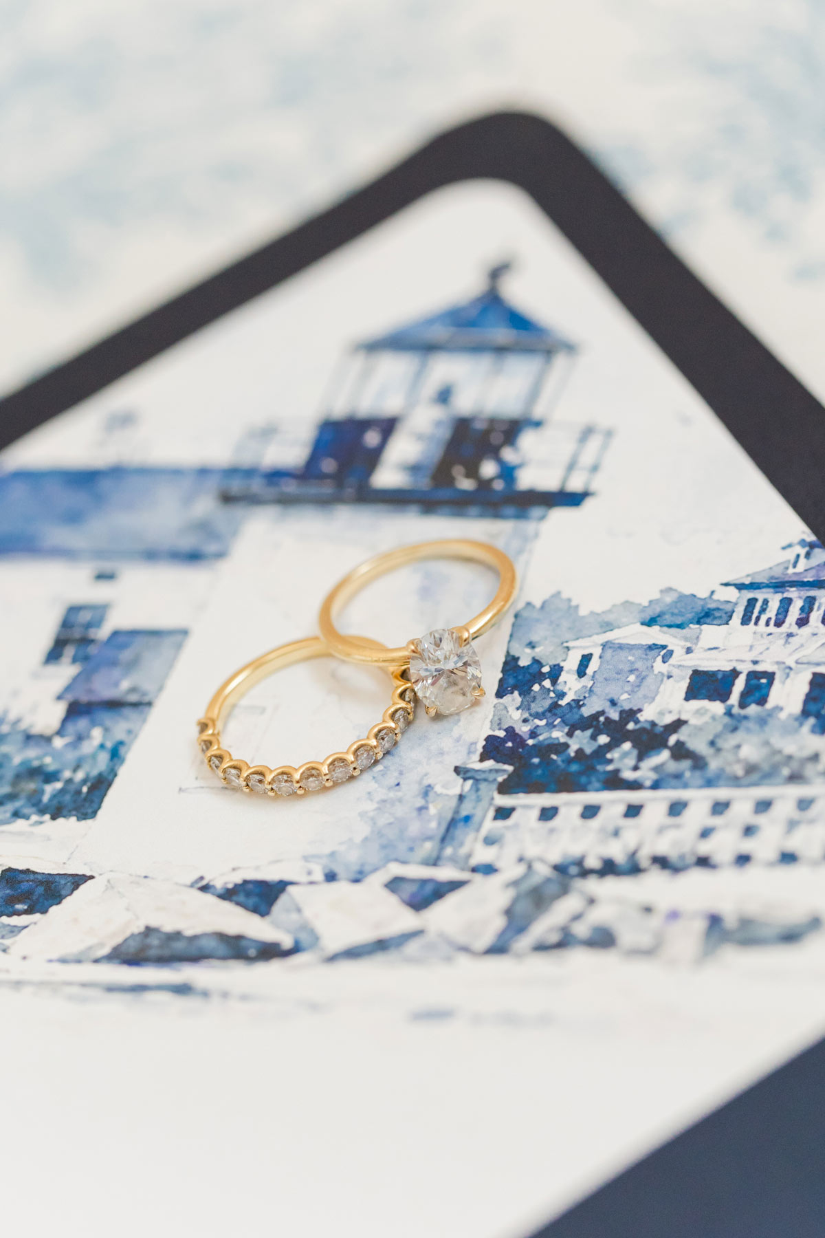 Navy blue A7 wedding invitation envelope with a custom watercolor envelope liner featuring a hand-painted illustration of a Nantucket lighthouse.
